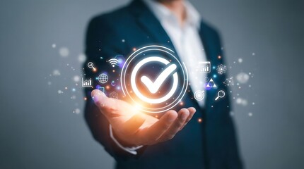 Businessman presenting a glowing checkmark icon with digital symbols