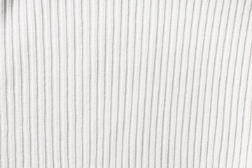 Obraz premium Texture of beige ribbed knit fabric as background