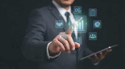 A professional businessman interacts with futuristic business icons on a digital interface, symbolizing innovation and growth in a modern business setting.