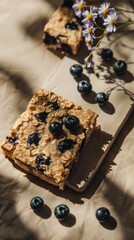 Baked Oatmeal Squares with Blueberries Cornflowers Beige Background