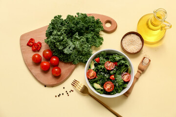 Composition with tasty kale salad and fresh ingredients on color background