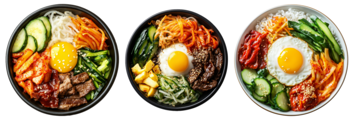 Korean bibimbap dish with fresh vegetables, fried egg, and gochujang sauce in black bowl isolated on white background