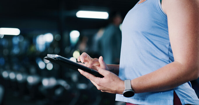 Person, hands and scroll in gym with tablet, workout research and sign up for personal trainer program. Bokeh, woman and digital tech with exercise website, internet and registration for fitness app.