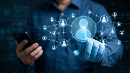 Man interacts with a glowing social network on his smartphone in a dark room, representing modern digital connections and online communication.