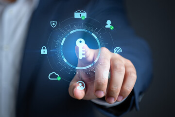 a person in a suit interacting with a digital interface of security and protection icons on their finger tip