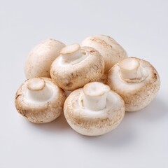 Fresh Whole White Mushrooms on a White Background Perfect for Culinary and Food Photography
