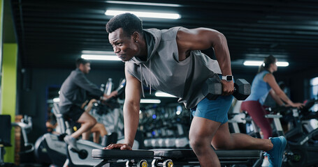 Fitness, bodybuilder or black man in center with dumbbell, endurance or bicep activity in weight...