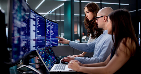 Team Of Engineers Collaborating On Software Development