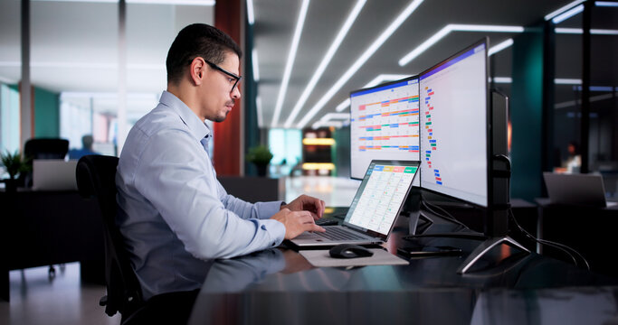 Hispanic Agile Project Manager Using Laptop