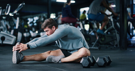 Man, stretching or gym with leg on floor for workout preparation, exercise or indoor training....