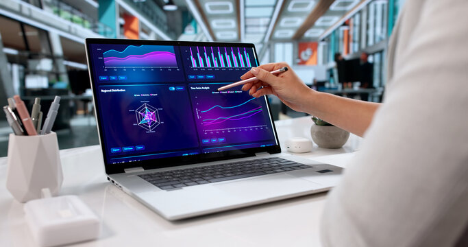 Female Financial Data Analyst Creating Marketing KPI Dashboard - Powered by Adobe