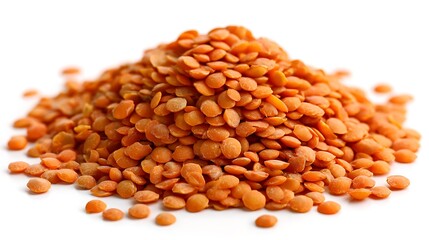 Small pile of dry red lentils showing round shape and matte texture