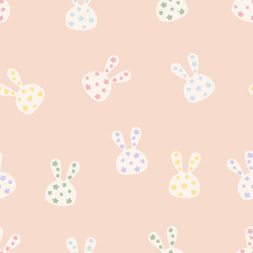 Rabbit head with dots pattern seamless. Bunny animal cartoon background. Pet design for fabric, wrapping, textile, wallpaper, apparel, pajamas, card, wrapping, stationery, phone cases.