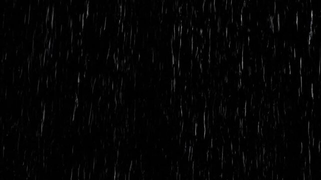 Raindrops streaking down on a black background