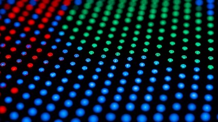 Vibrant led screen display with red green and blue dots on black background technology and innovation concept