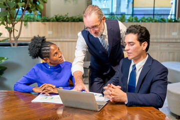 Business working team work with laptop and document paper in co-working space area.
