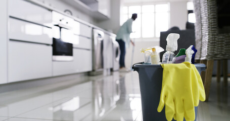 Glove, floor or bucket with cleaning supplies for home maintenance, antibacterial product or spray....