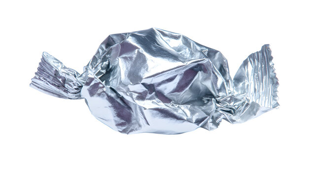 A crumpled silver foil chewing gum wrapper isolated on a white background with a shiny reflective surface and twisted ends with packaging and waste