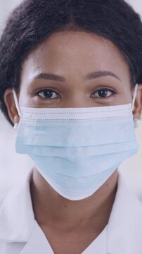 Scientist, face of woman and mask in laboratory for compliance, medical research or pathology. Pathologist, black person or safety for science experiment, vaccine innovation or ready for cancer study