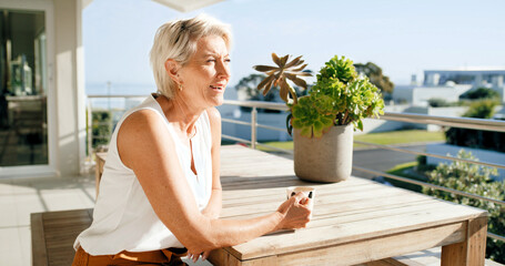 Naklejka premium Balcony, coffee and thinking with senior woman at apartment for break, reflection or retirement. Home, ideas or relax and old female person with drink outdoor for fresh air, me time or planning