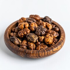 Obraz premium Wooden bowl filled with richly colored nuts presented on white background