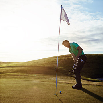 Golf course, putt and man for training, fitness and game outdoor on grass with swing. Athlete, flag and golfer at sports club with space for cardio, workout and hobby on green with shot practice