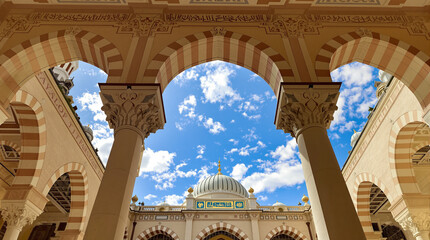 Fototapeta premium Beautiful Islamic Architecture with Ornate Arches, Columns, and Dome