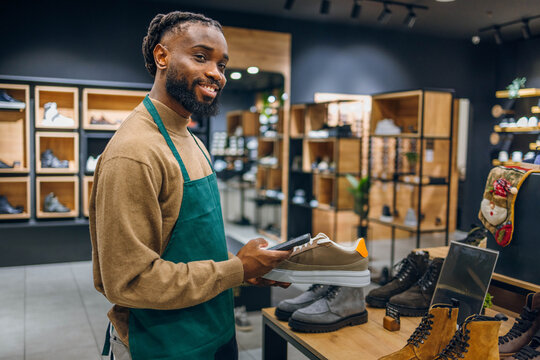Successful man retail seller in his store
