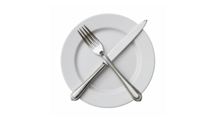 Clean white plate with silverware crossed on black background