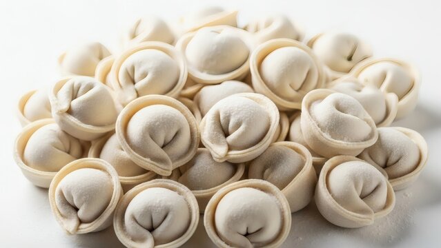 Dumpling Delight Pile of frozen dumplings on white background with ready to cook.