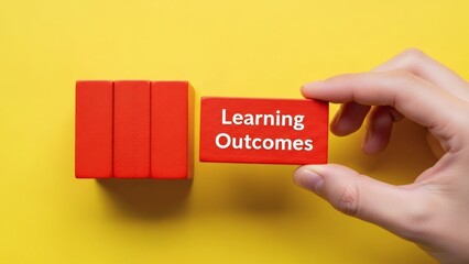 Building Blocks Learning Outcomes Concept on Yellow.