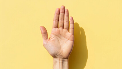 Naklejka premium Child hand is making a simple finger gesture symbolizing communication and success