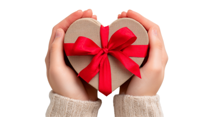 Hands holding a heart shaped gift box with red ribbon on transparent background
