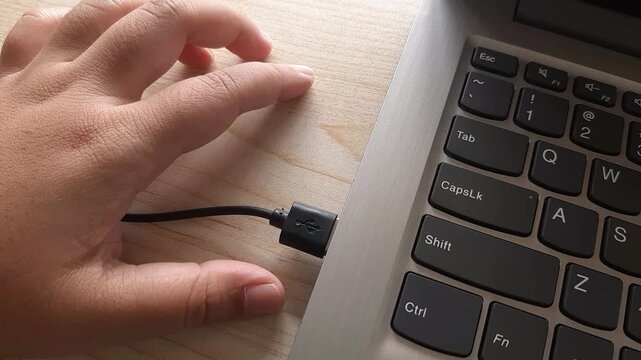 Plug a USB cable into the laptop port