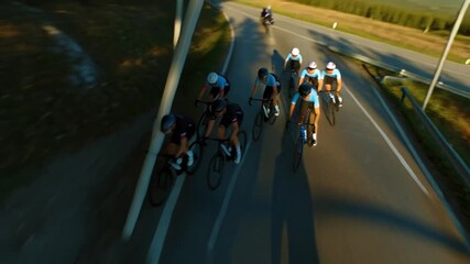 Cyclists racing on a sunny road