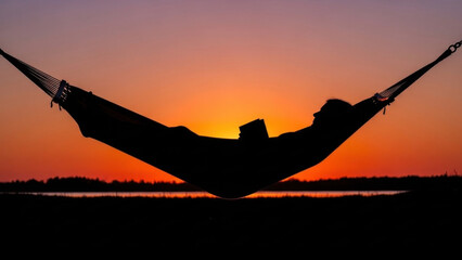 Silhouette of woman relaxing in a hammock with a book, against a vibrant sunset sky, netting gently cradling her as she enjoys the tranquil evening atmosphere