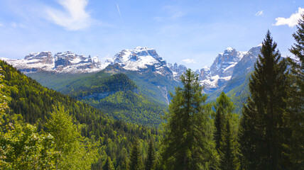 Obraz premium The dramatic limestone peaks of the Brenta Dolomites rising above the alpine landscape of northern Italy.