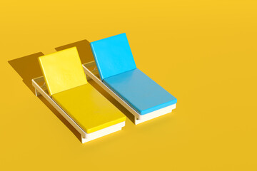 Two empty sunbeds casting shadows on a yellow background
