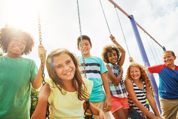 Kids, playground and portrait with group of friends outdoor together for bonding or development. Fun, summer break and swinging with happy children at park for growth, holiday or relationship