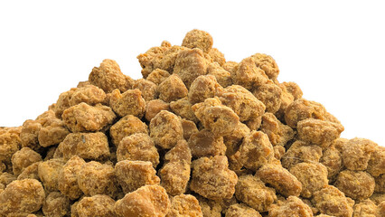 close-up macro view of jaggery pieces, golden brown colored cube shaped unrefined sugar product also called kithul jaggery or palm sugar, sweet and sugary traditional food in southeast asia isolated, 