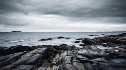 Minimal Rocky Shoreline Under Moody Overcast Sky &ndash; Calm Seascape storm clouds over the sea