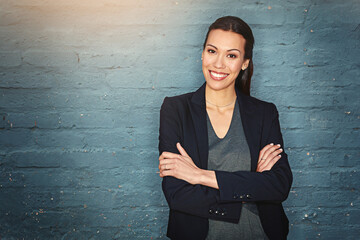 Portrait, arms crossed and business woman on wall background, space and confident lawyer. Smile,...