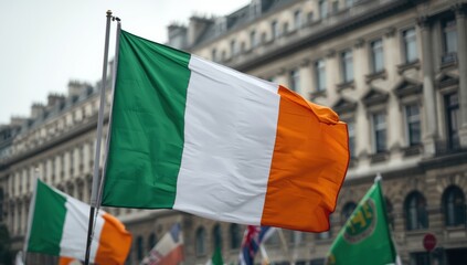 Waving Irish Flag on Pole with Buildings in Background, Stock Media