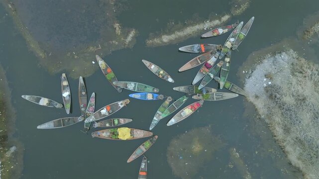 Aerial view of traditional boats and floating vendors on Dal Lake in Srinagar, Jammu and Kashmir, India