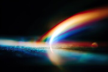 Abstract, colorful light streaks arc across a dark surface, creating a visual spectacle