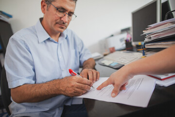 Accountant Consulting Client in Office