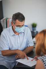 Accountant Consulting Client in Office