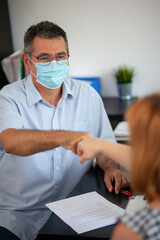 Accountant Consulting Client in Office