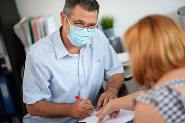 Accountant Consulting Client in Office