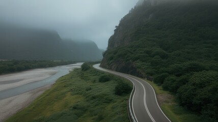 Winding Mountain Road Alongside River and Foggy Peaks, Dramatic Landscape Illustration
